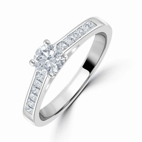 0.66ct Round Brilliant Cut Diamond Solitaire Platinum Ring with Diamond Shoulders texture-diamond  