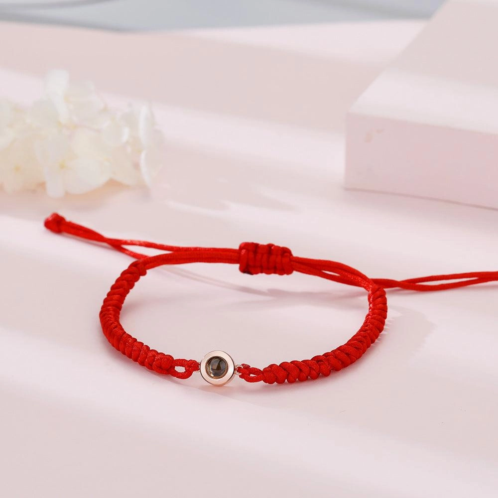 A Pair Of Braided Red And Black Rainbow Hand Ropes