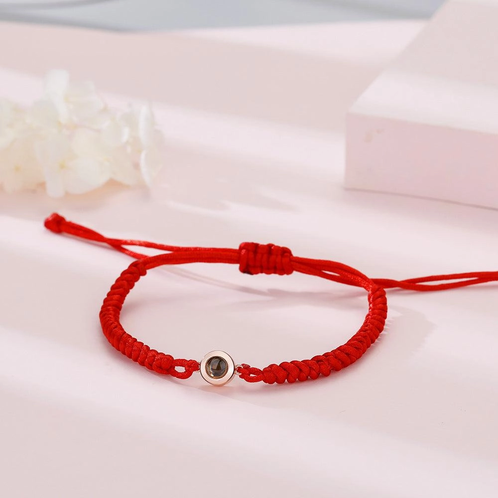 A Pair Of Braided Red And Black Rainbow Hand Ropes