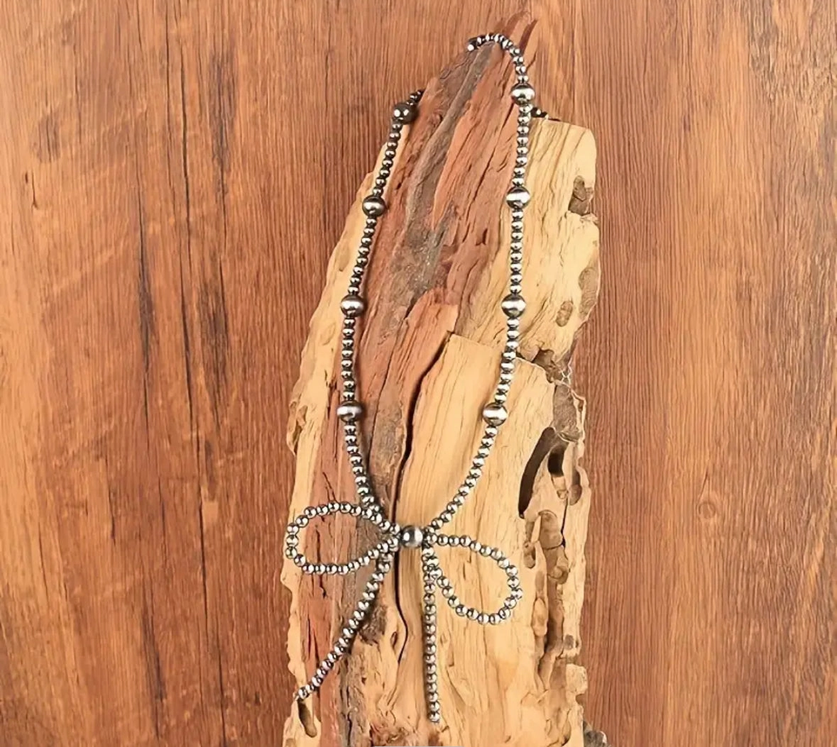 Beaded Bow Necklace texture-rose-gold  