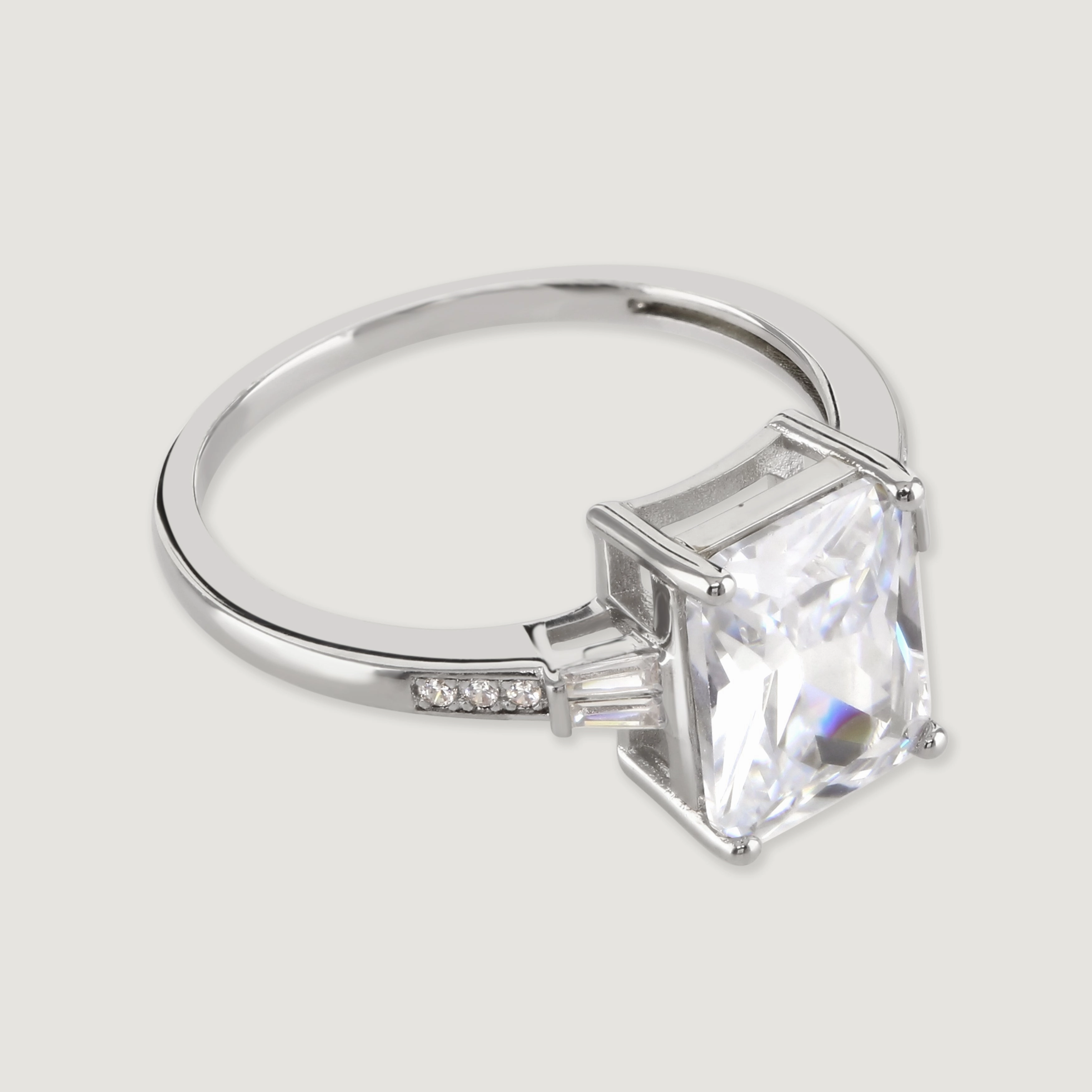 Buckley London The Carat Collection? Clear Baguette With Tapered Baguette Shoulders Ring Rhodium L SS24 fashion-jewelry  