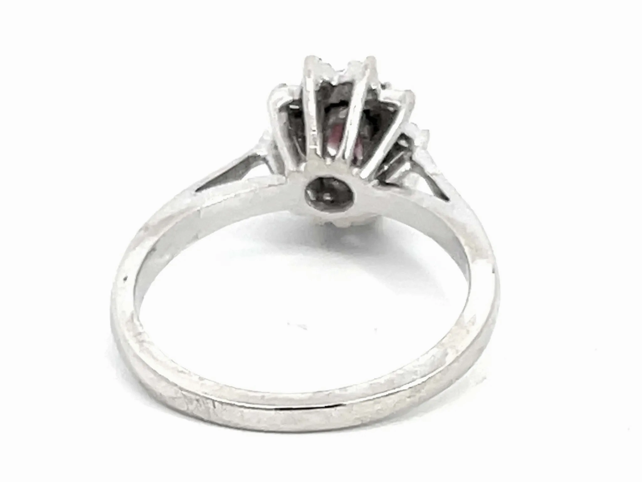 Oval Ruby and Diamond Halo Ring in 14k White Gold