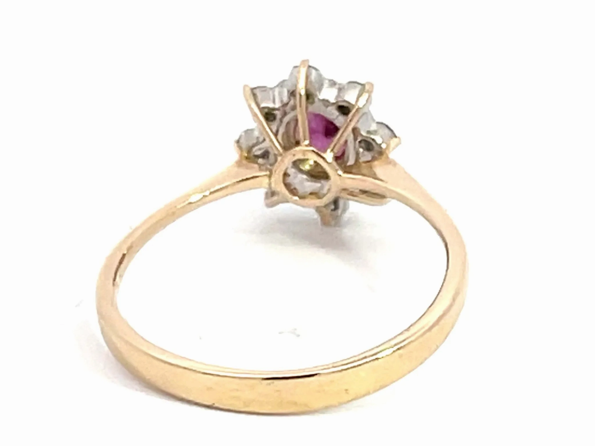 Oval Ruby and Diamond Halo Ring in 14k Yellow Gold