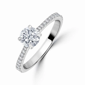 Platinum 0.71ct Round Brilliant Cut Diamond Solitaire Ring with Diamond Shoulders texture-diamond  