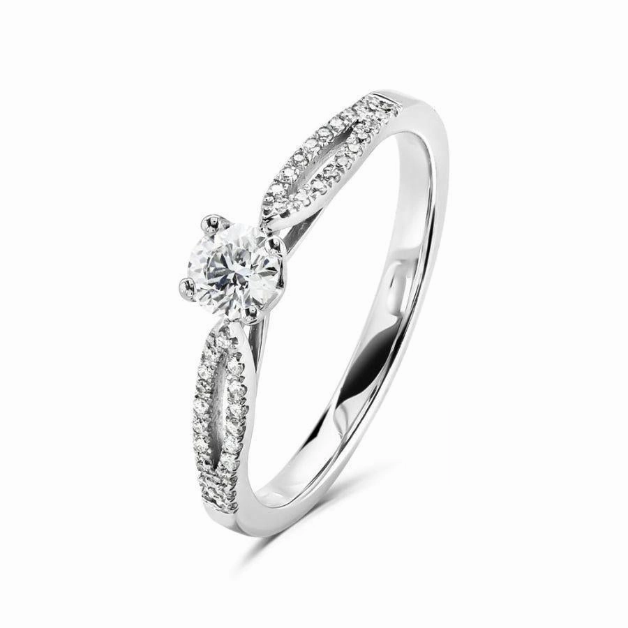 Platinum 4 claw set round brilliant cut Diamond solitaire ring with split claw set Diamond shoulders texture-diamond  