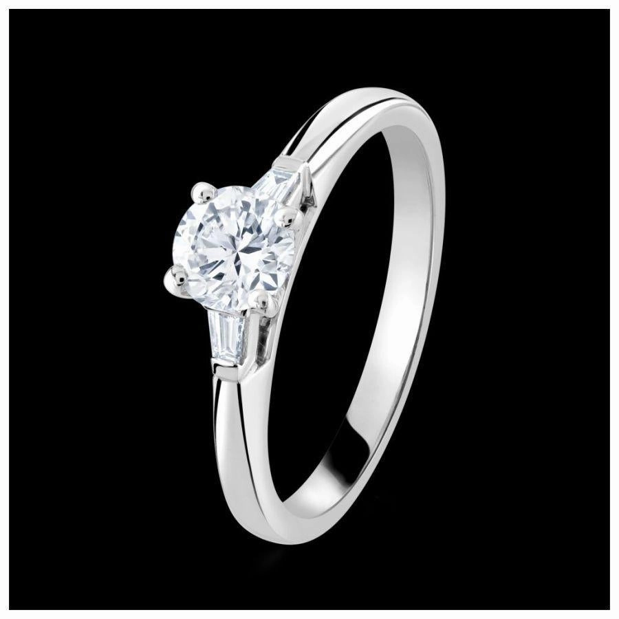 Platinum 4-claw set round brilliant cut Diamond solitaire ring with two tapered Diamonds texture-diamond  
