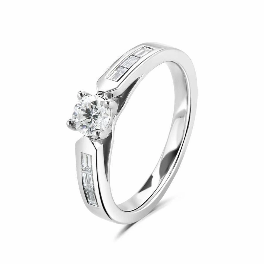 Platinum brilliant cut diamond ring with diamond set shoulders texture-diamond  