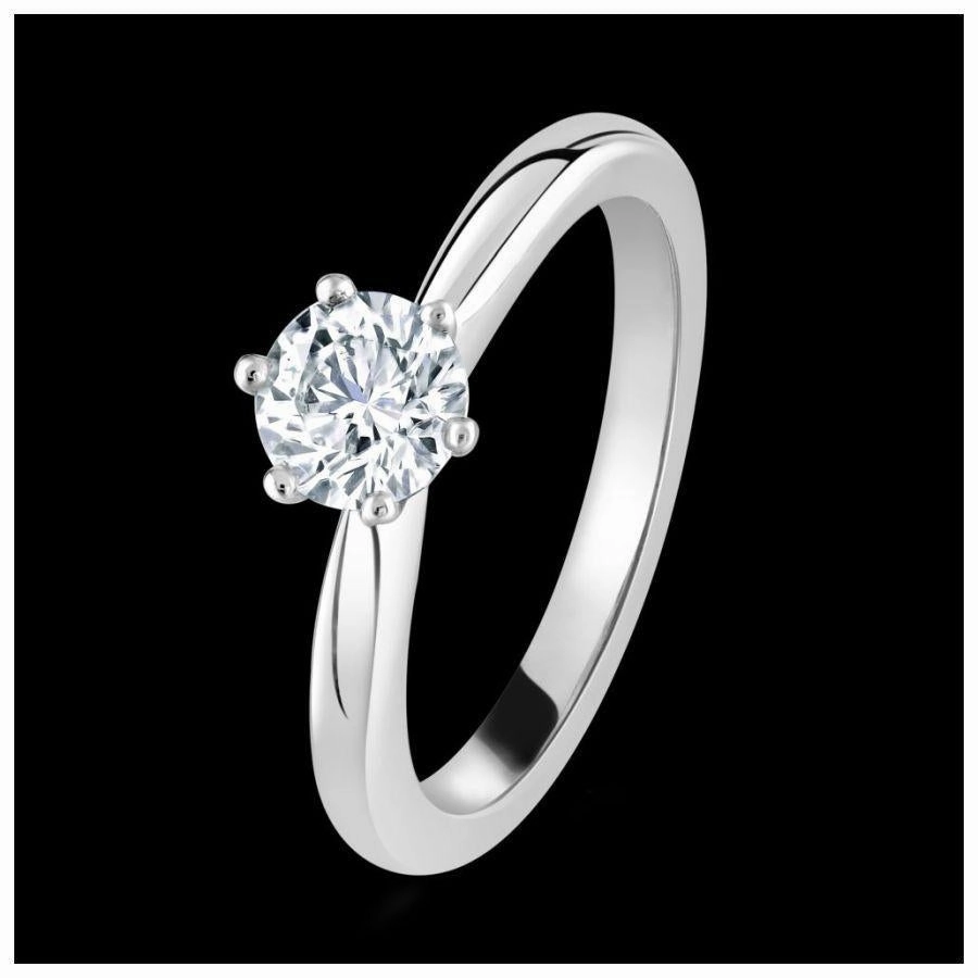 Platinum claw set round brilliant cut Diamond solitaire ring texture-diamond  