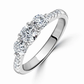 Platinum Round Brilliant Cut Diamond Trilogy Ring with Diamond Shoulders texture-diamond  