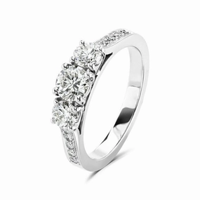 Platinum Round Brilliant Cut Diamond Trilogy Ring with Diamond Shoulders texture-diamond  