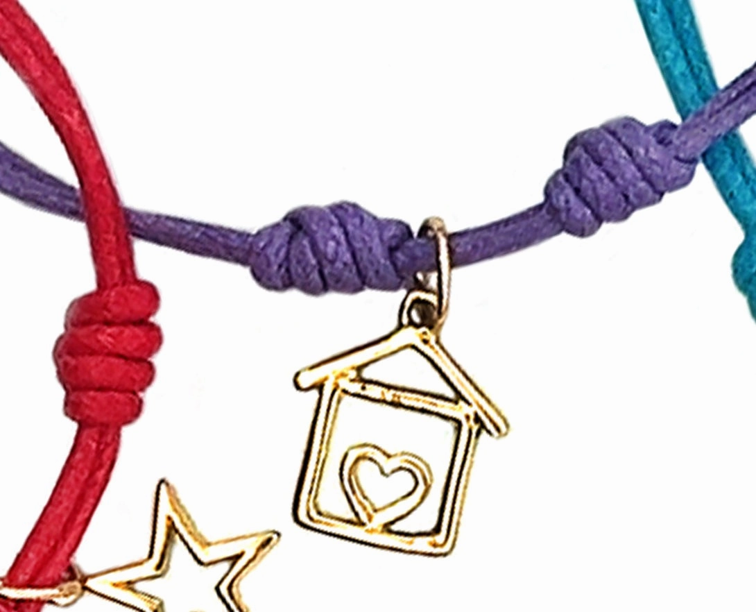 Rope bracelets with dangling yellow gold charms
